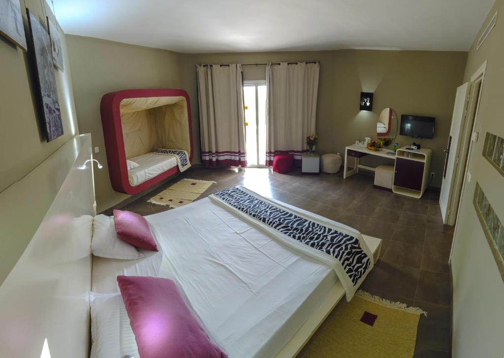 Postel nebo postele na pokoji v ubytování Fiesta Beach Djerba