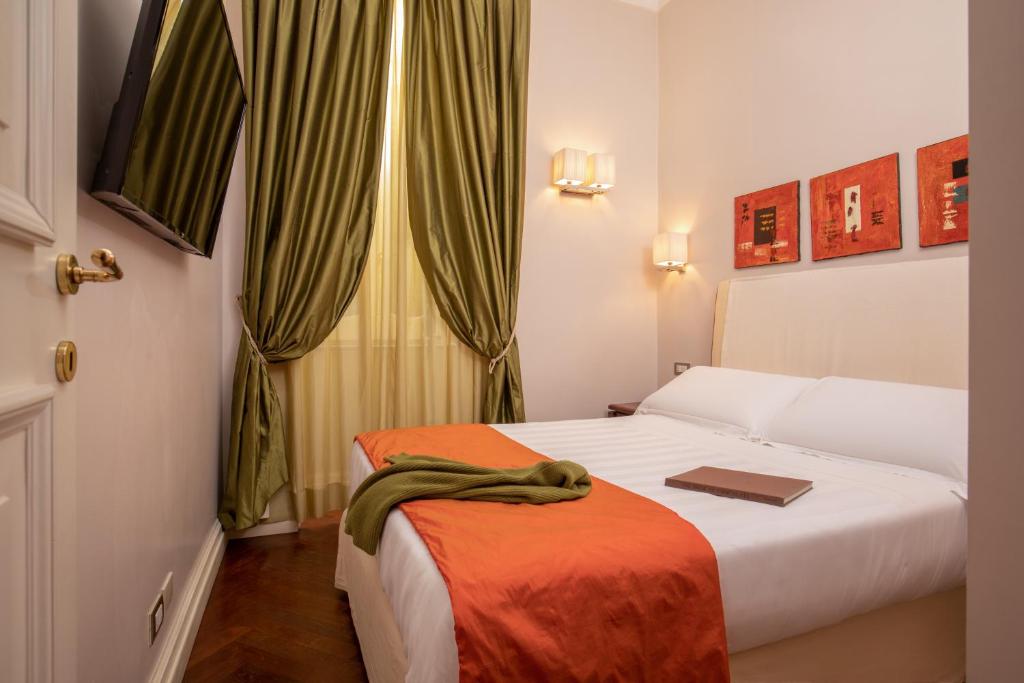 Postel nebo postele na pokoji v ubytování Hotel Mozart