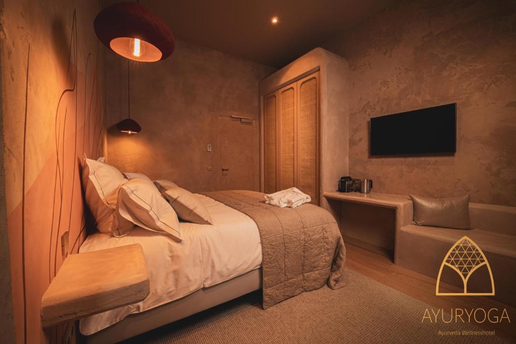 Postel nebo postele na pokoji v ubytování Ayuryoga Wellnesshotel