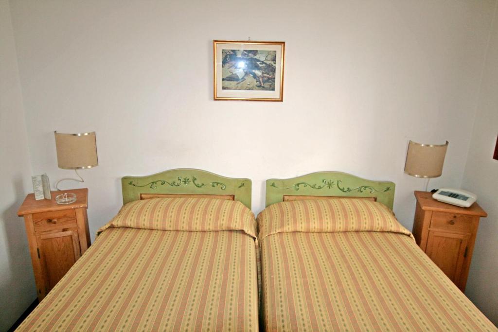 En eller flere senger på et rom på Villa Nencini