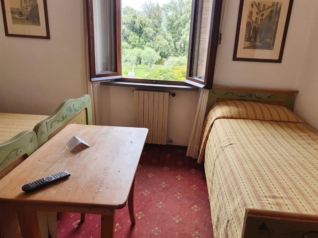 En eller flere senger på et rom på Villa Nencini