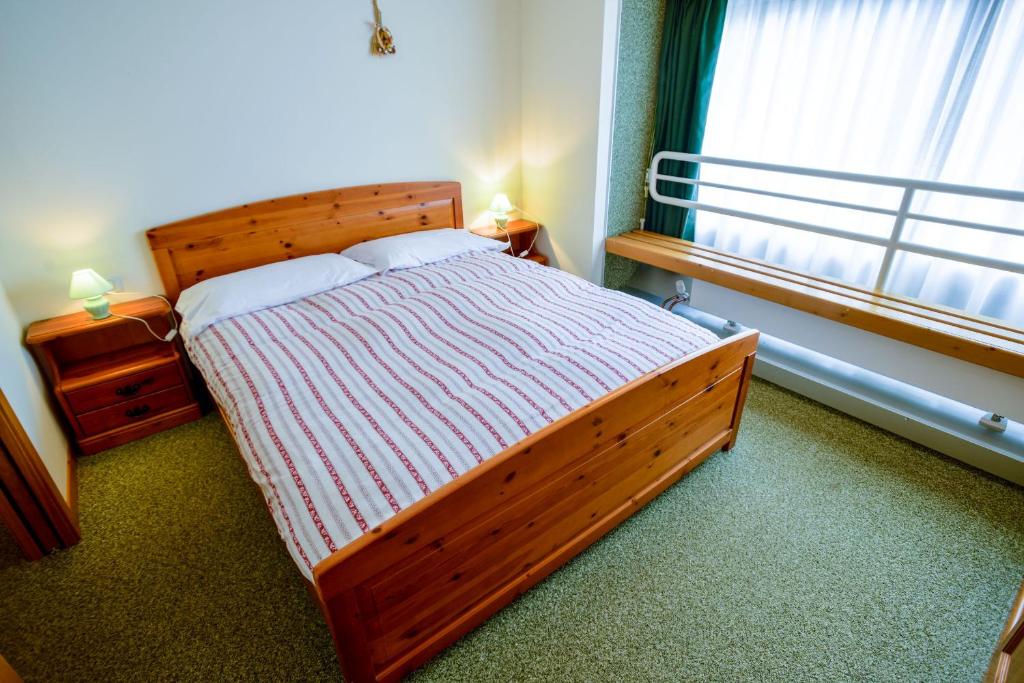 Postel nebo postele na pokoji v ubytování Res.Albarè/Solaria Apt.Solandra