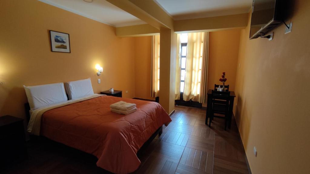 Rúm í herbergi á Hotel Golden Killa