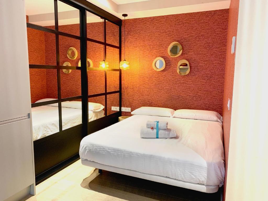 Postel nebo postele na pokoji v ubytování Sea to Sky Suites - Mijas Pueblo