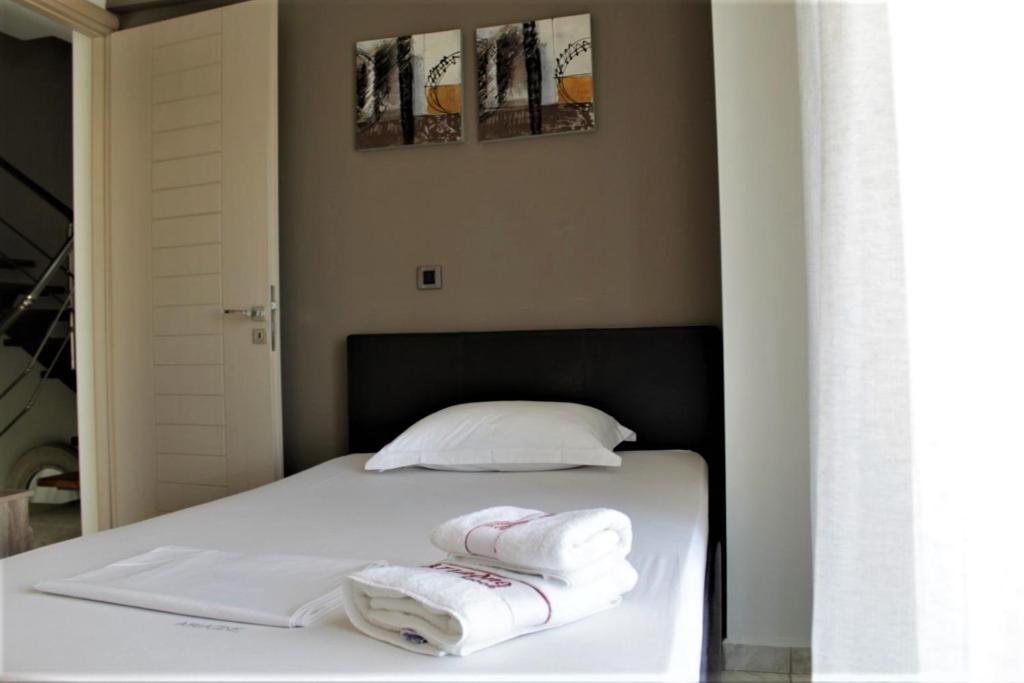 Postel nebo postele na pokoji v ubytování Casa Ariadne