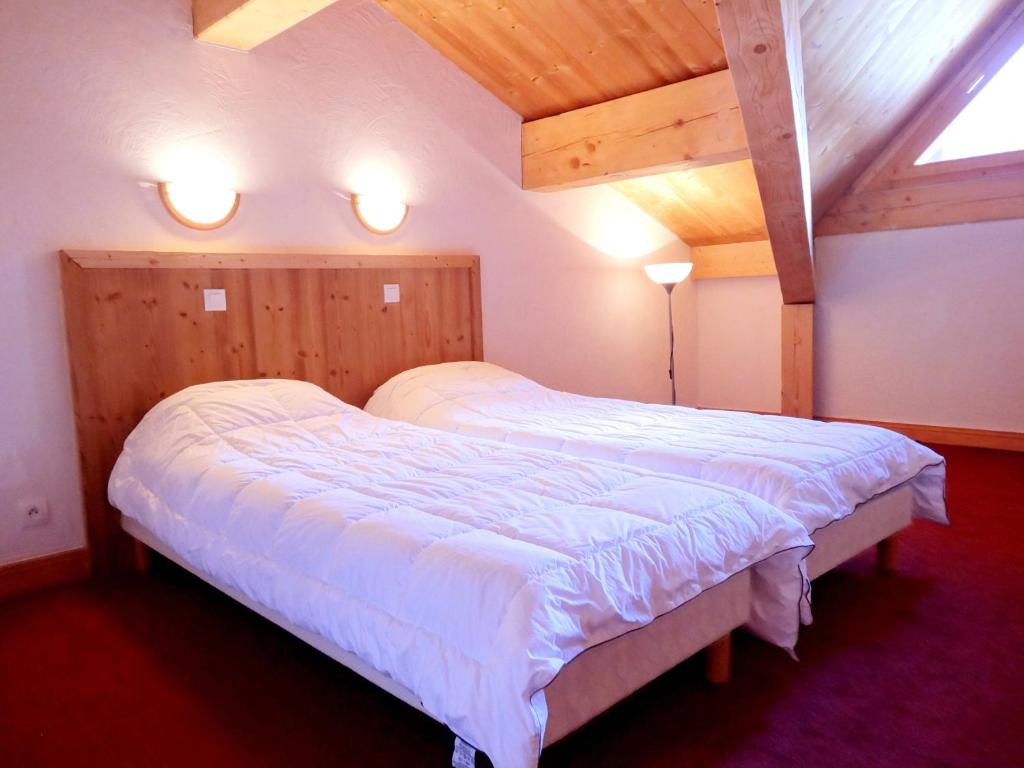 Postel nebo postele na pokoji v ubytování Chalet des Neiges Plein Sud
