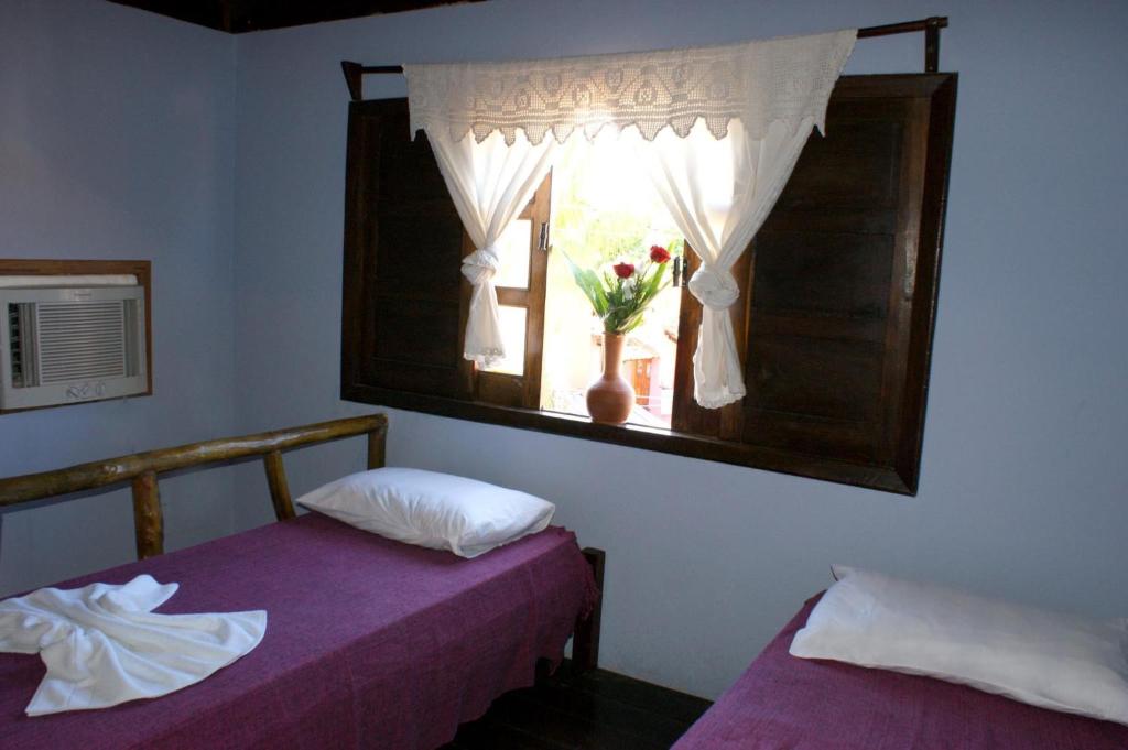 Cama ou camas em um quarto em Pousada Estrela Itacaré