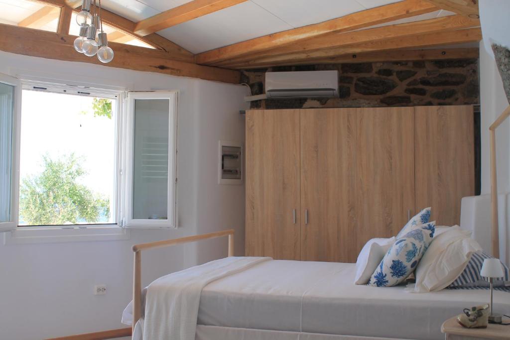 Posteľ alebo postele v izbe v ubytovaní Luxury Suites Poseidon
