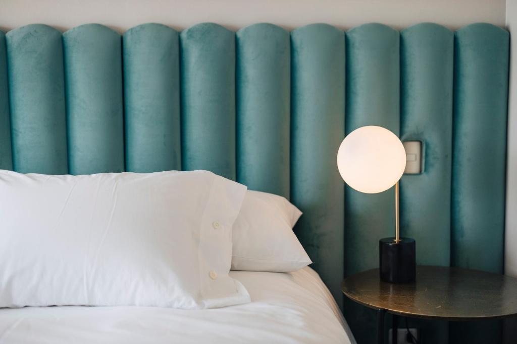 Postel nebo postele na pokoji v ubytování Casablu Hotel