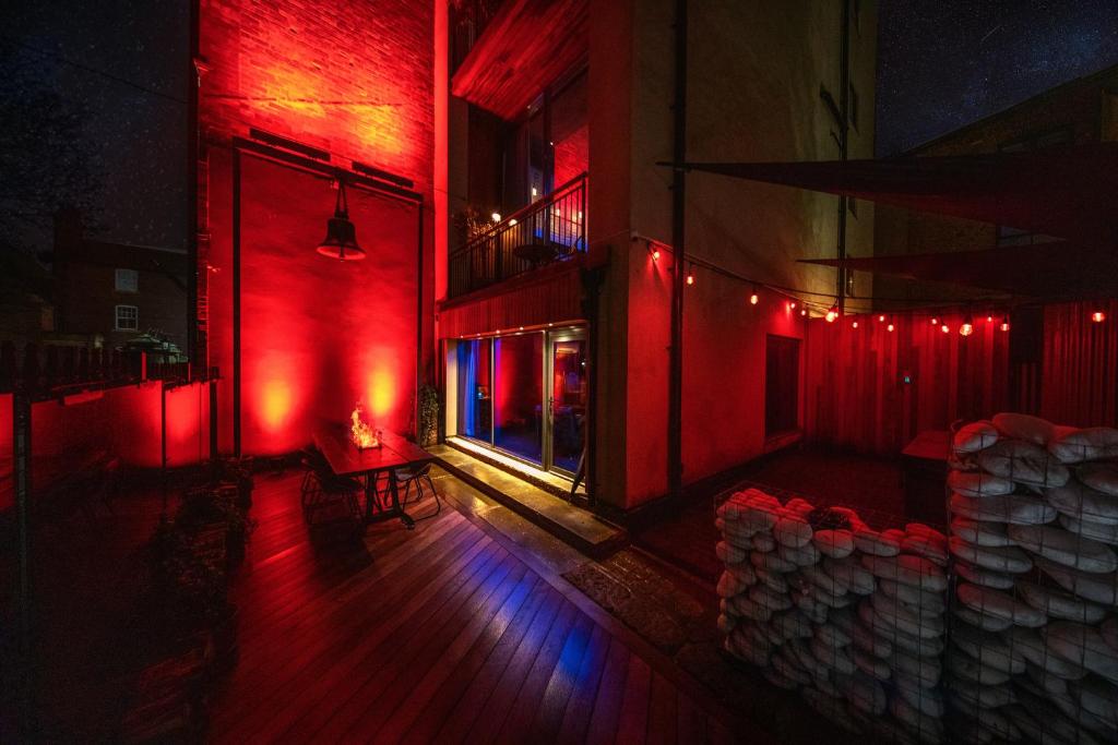 an empty room with red lights on a building at The Bells - Luxury Serviced Apartments in Leeds