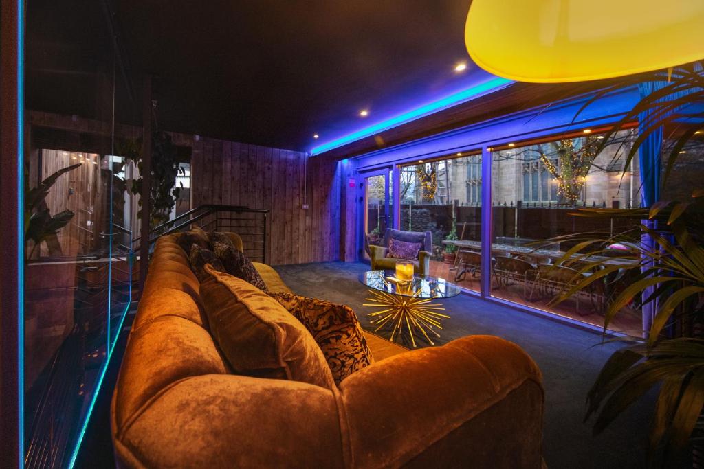 a living room with a couch in a room at The Bells - Luxury Serviced Apartments in Leeds