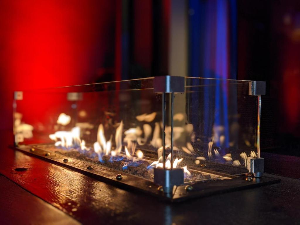 a close up of a fireplace with candles at The Bells - Luxury Serviced Apartments in Leeds