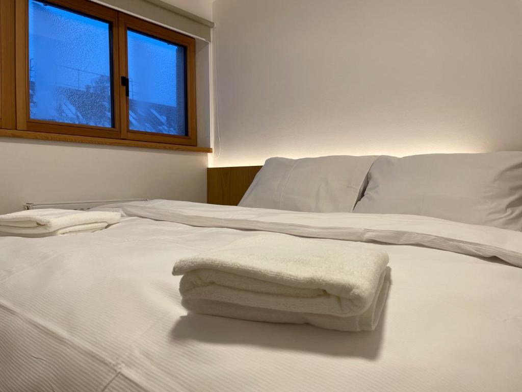 Postel nebo postele na pokoji v ubytování Apartmány Hacienda Boží Dar