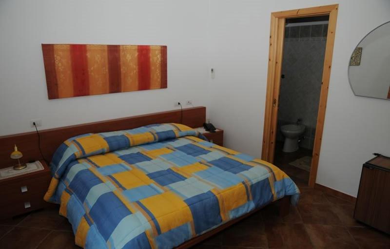 Postel nebo postele na pokoji v ubytování Hotel California