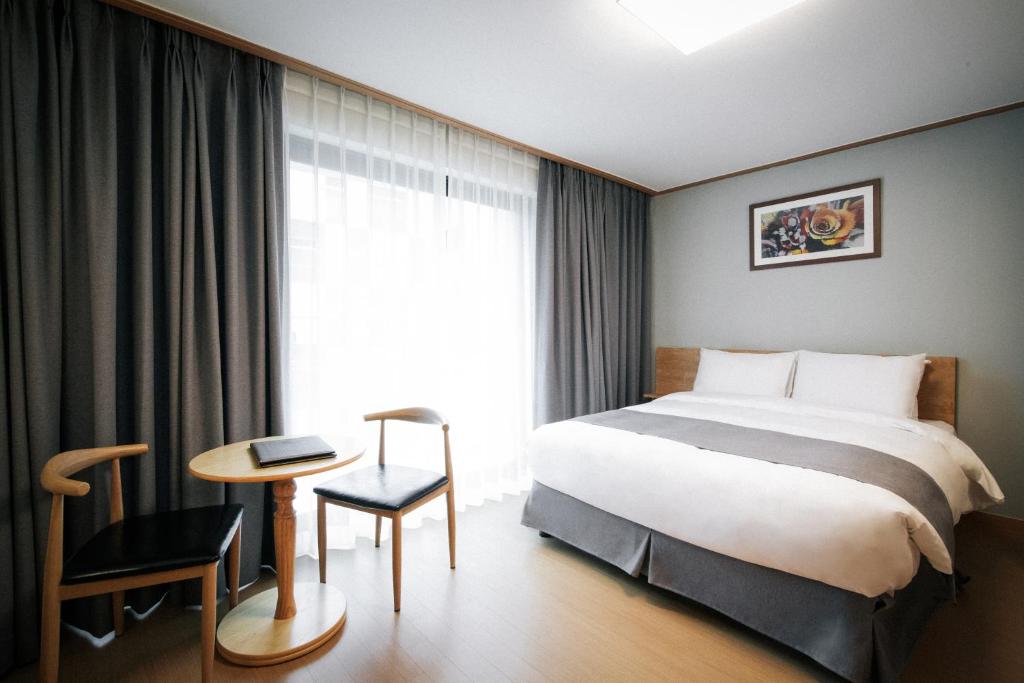 Postel nebo postele na pokoji v ubytování The N Resort Hotel&Spa YangYang