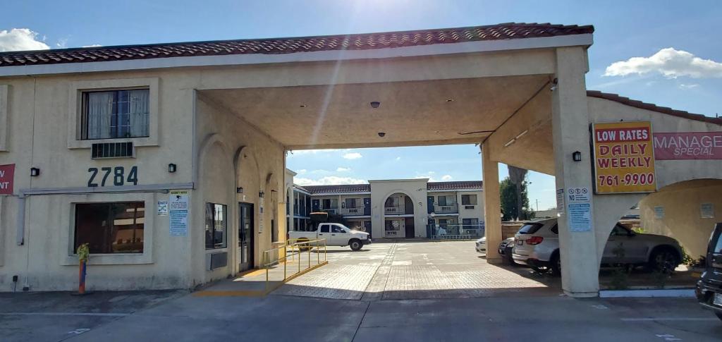 an empty parking lot in front of a building at Anaheim National Inn in Anaheim