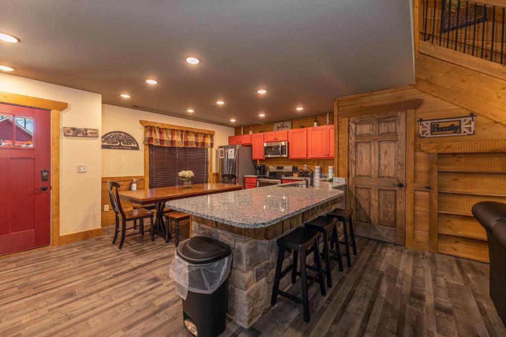 a kitchen with a large island with bar stools at BearVue Point chalet in Gatlinburg