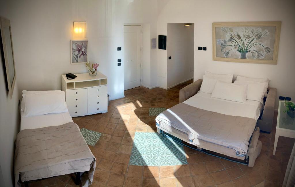 Postel nebo postele na pokoji v ubytování Miglio d'Oro Park Hotel