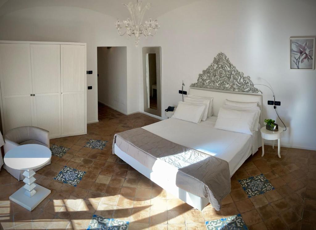 Postel nebo postele na pokoji v ubytování Miglio d'Oro Park Hotel