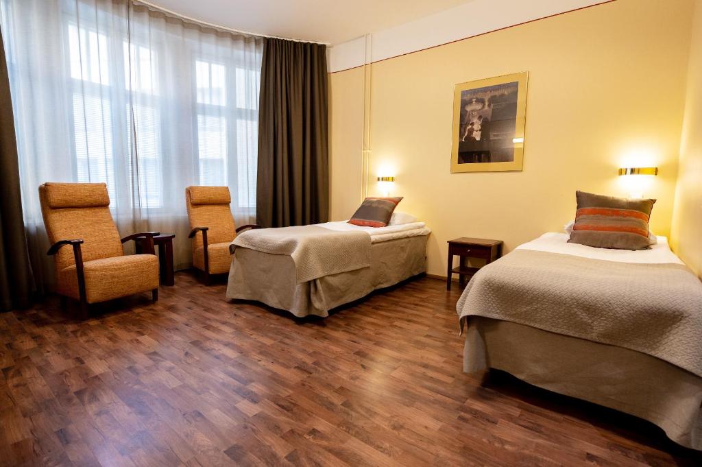 Postel nebo postele na pokoji v ubytování Hotel Arthur