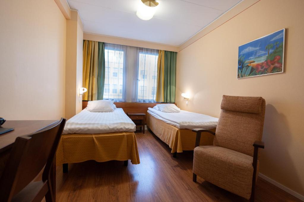 Postel nebo postele na pokoji v ubytování Hotel Arthur