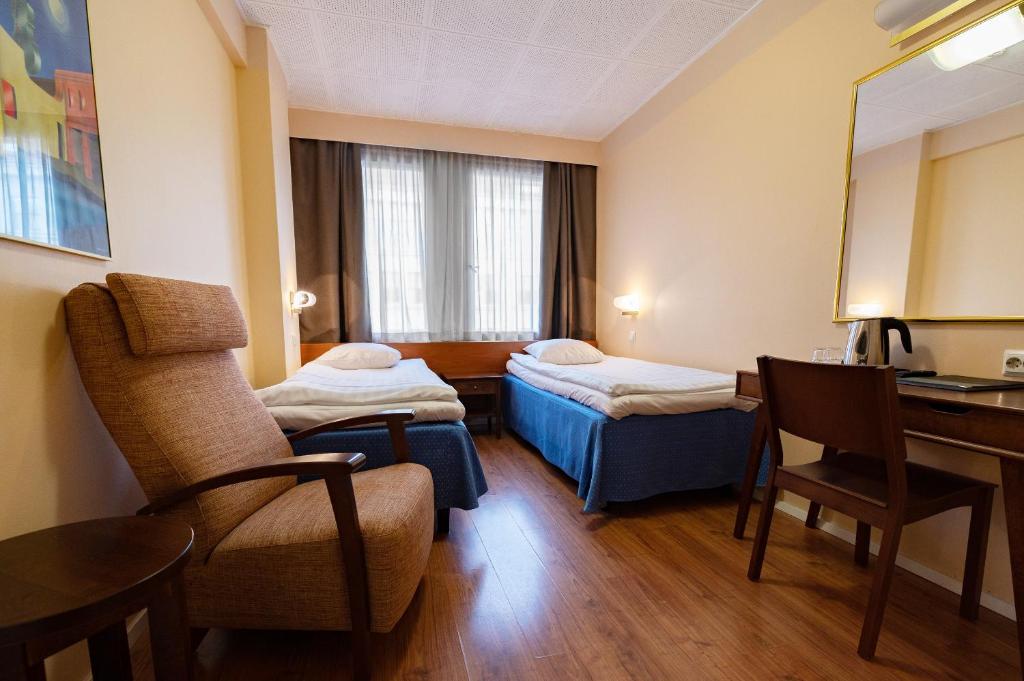 Postel nebo postele na pokoji v ubytování Hotel Arthur