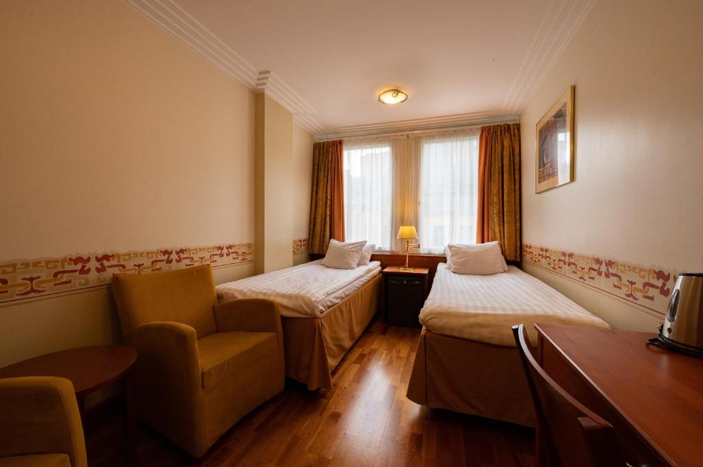 Postel nebo postele na pokoji v ubytování Hotel Arthur