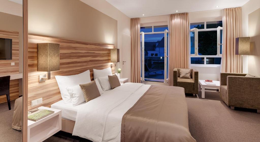 Postel nebo postele na pokoji v ubytování Hotel Im Schulhaus