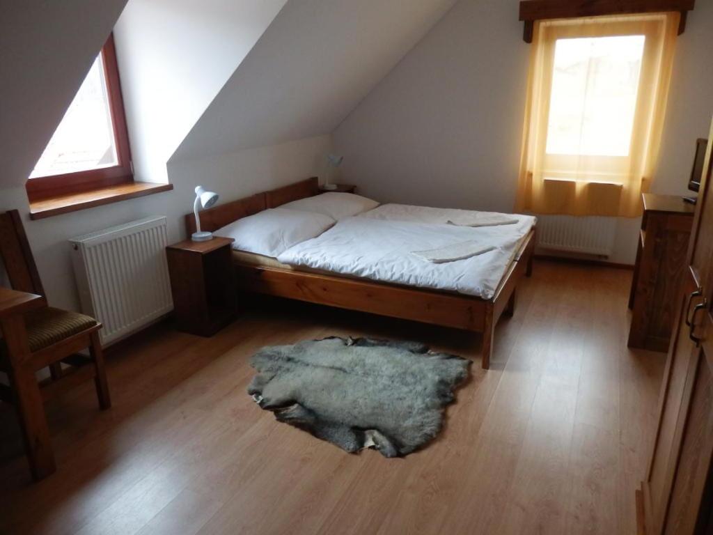Postel nebo postele na pokoji v ubytování Penzion Dočkalův mlýn