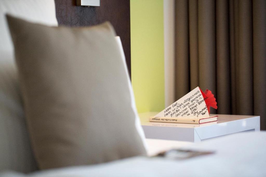 Postel nebo postele na pokoji v ubytování Hotel Im Schulhaus