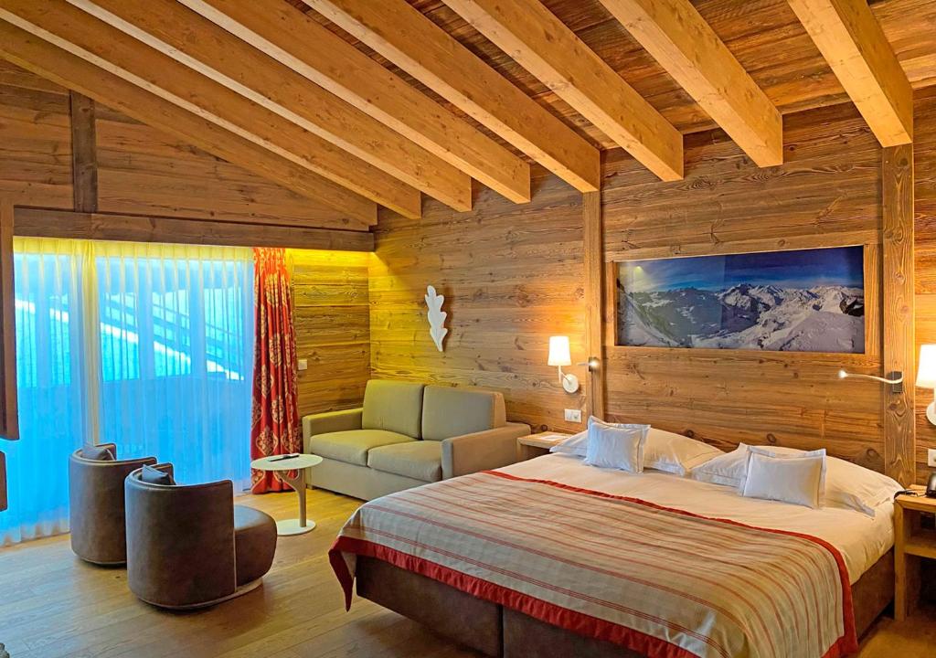 Postel nebo postele na pokoji v ubytování Nendaz 4 Vallées & SPA 4* Superior