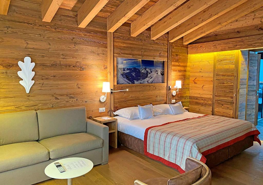 Postel nebo postele na pokoji v ubytování Nendaz 4 Vallées & SPA 4* Superior