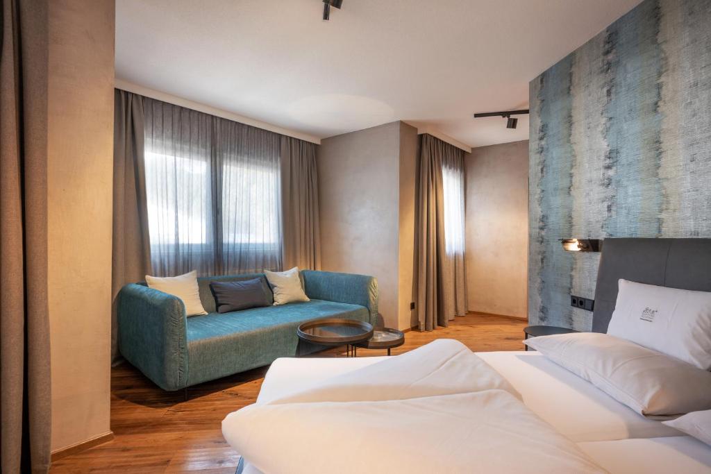 Postel nebo postele na pokoji v ubytování Familienparadies Sporthotel Achensee - FAMILIES ONLY