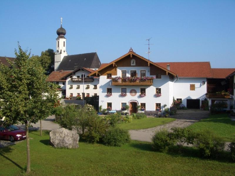 a large white building with a lighthouse on top of it at Beim Wagner in Nußdorf