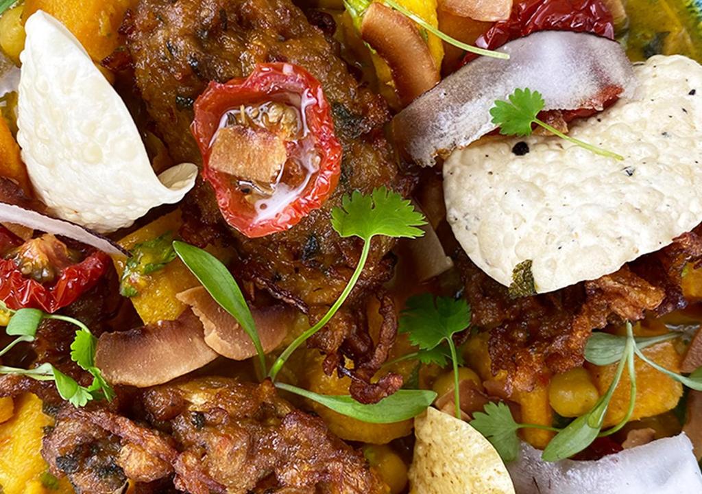 a pile of food with meat and vegetables on a plate at Harbour Heights Hotel in Poole