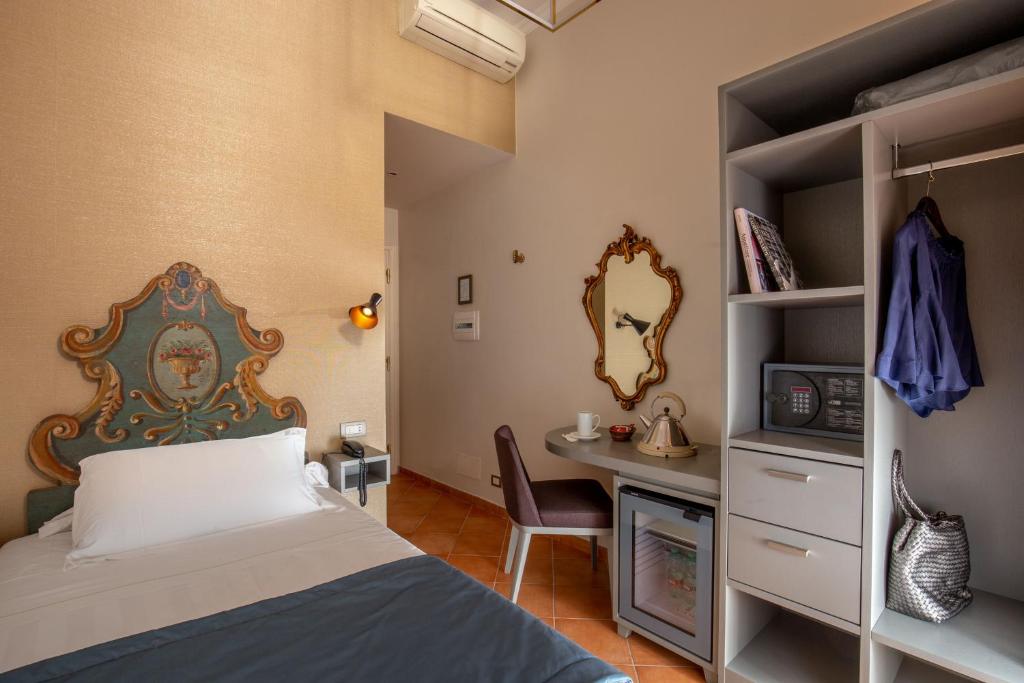 Postel nebo postele na pokoji v ubytování Hotel Mozart