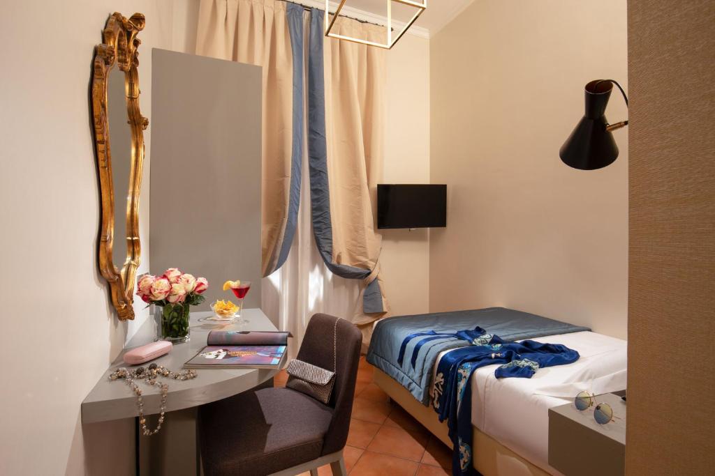 Postel nebo postele na pokoji v ubytování Hotel Mozart