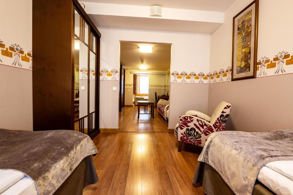 Postel nebo postele na pokoji v ubytování Hotel Arthur