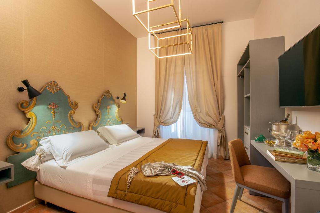 Postel nebo postele na pokoji v ubytování Hotel Mozart