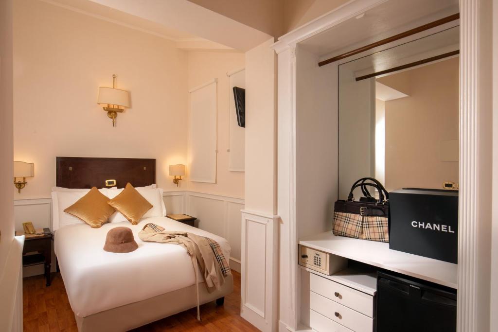 Postel nebo postele na pokoji v ubytování Hotel Del Corso