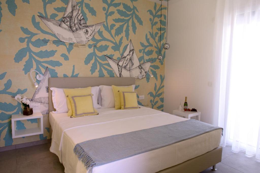 A bed or beds in a room at Hotel Alexandra - Beach Front - Healthy XXL Breakfast & Brunch until 12 30 - parking included