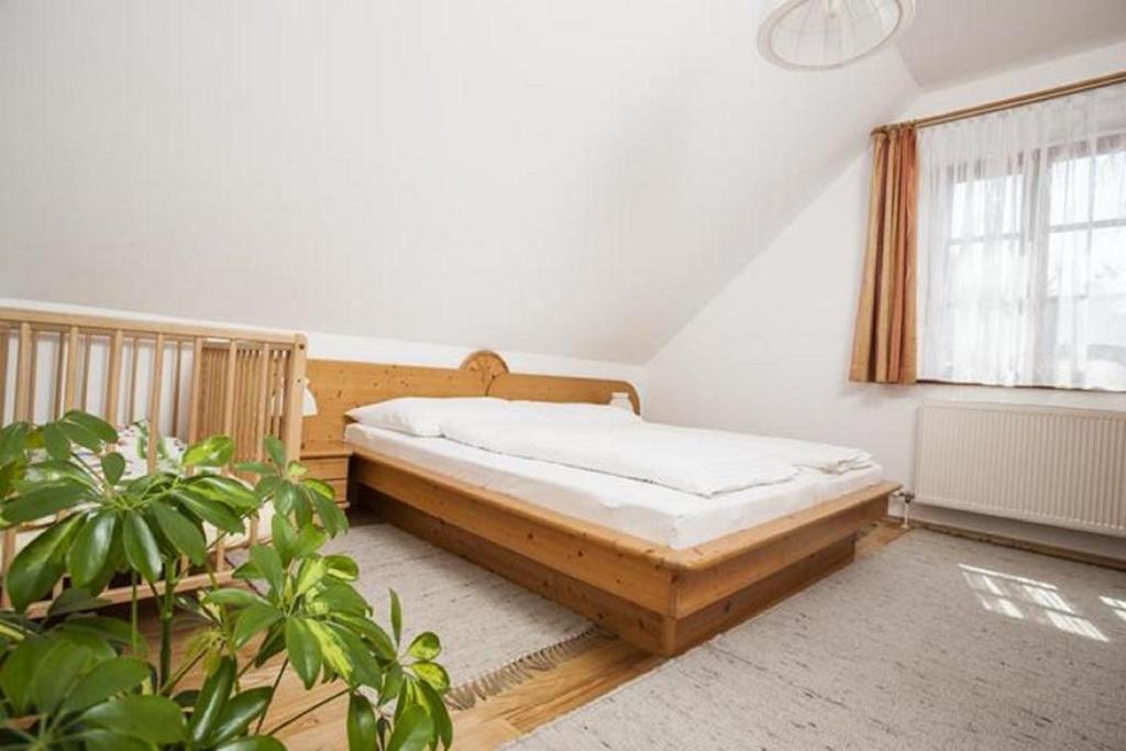 Postel nebo postele na pokoji v ubytování Winzerhof - Gästehaus Stöger