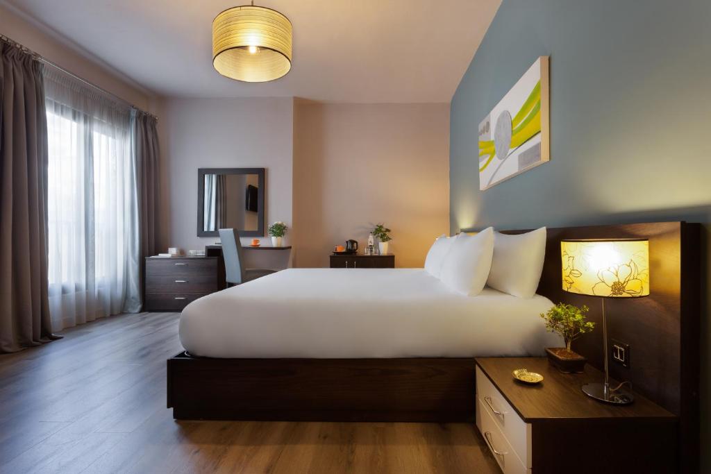 Postel nebo postele na pokoji v ubytování Hotel Argento