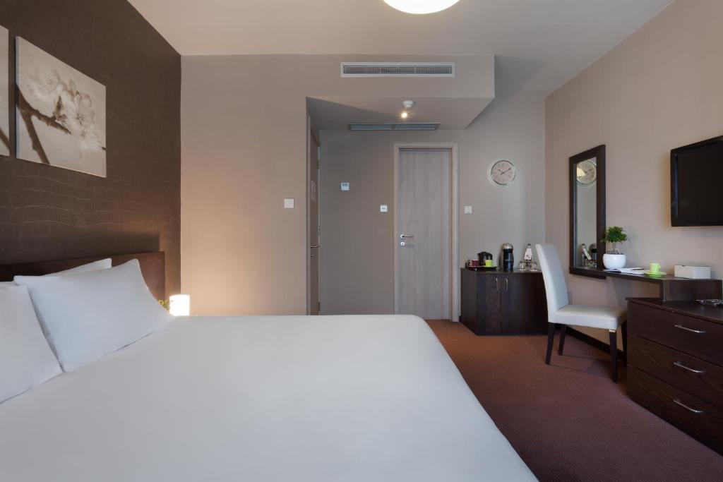 Postel nebo postele na pokoji v ubytování Hotel Argento
