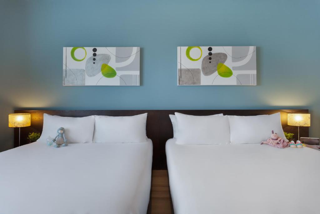 Postel nebo postele na pokoji v ubytování Hotel Argento