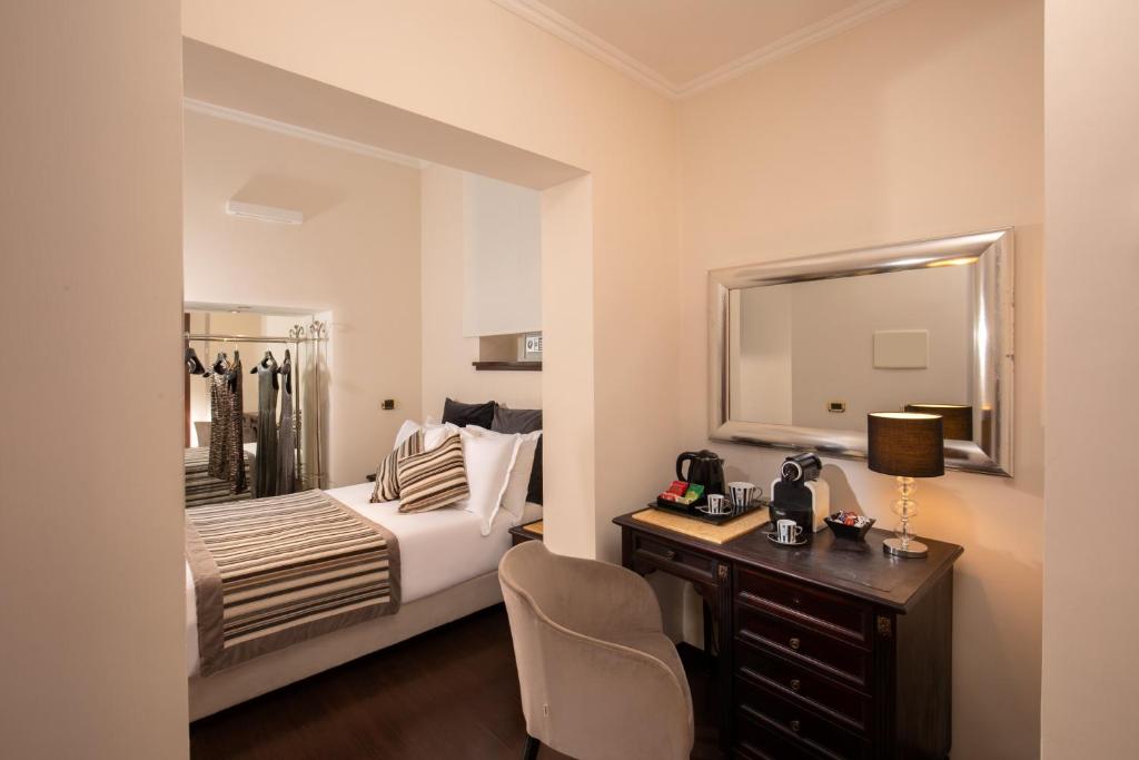 Postel nebo postele na pokoji v ubytování Hotel Del Corso