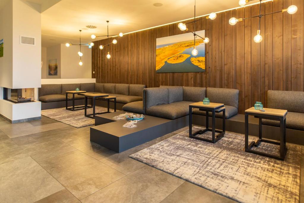 Posezení v ubytování Aparthotel Waterkant Suites - Fewos am Meer mit SPA