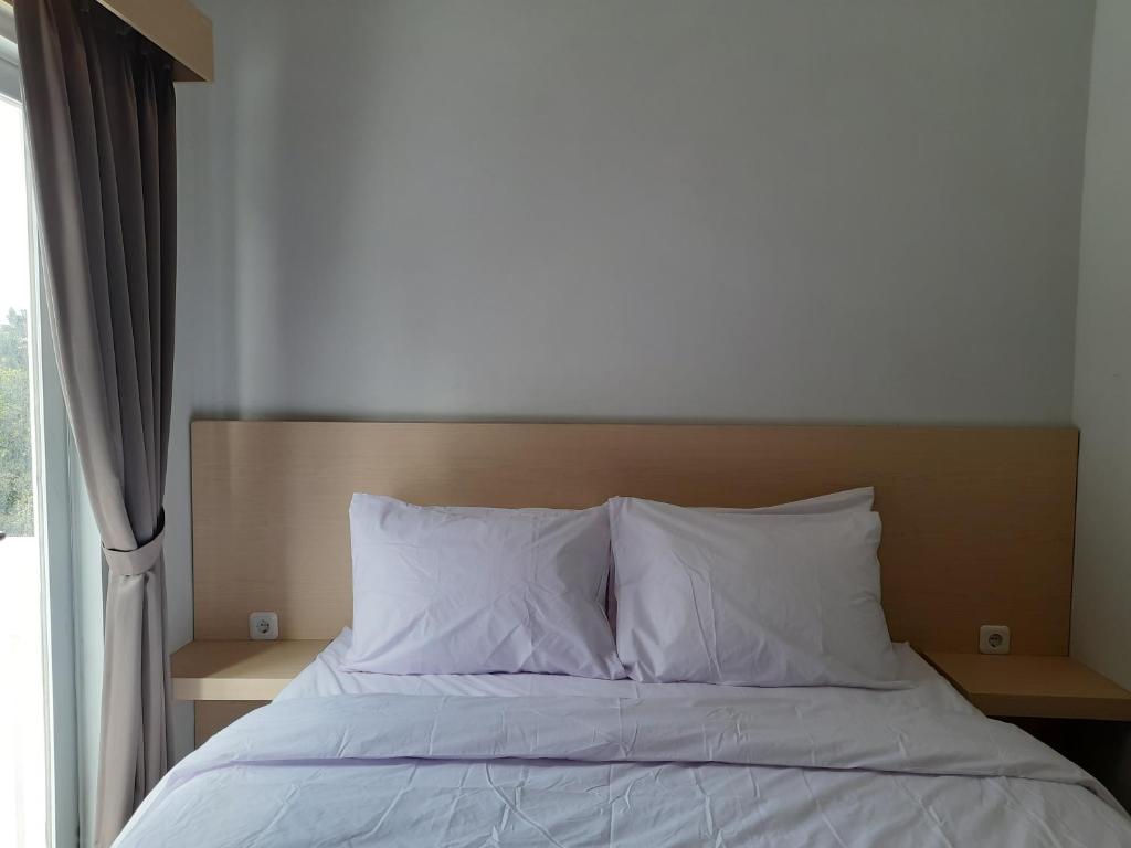 Postel nebo postele na pokoji v ubytování Mahakam24 Residence