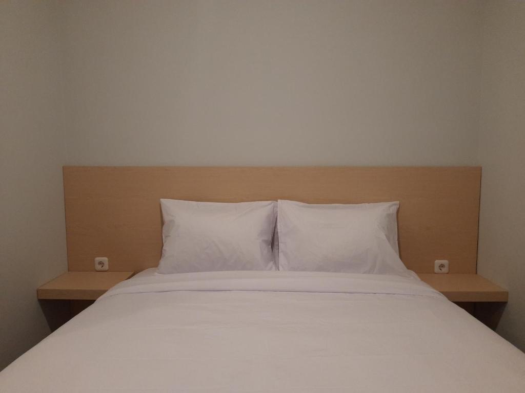 Postel nebo postele na pokoji v ubytování Mahakam24 Residence