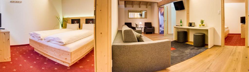 Postel nebo postele na pokoji v ubytování Hotel Cristal Flumserberg